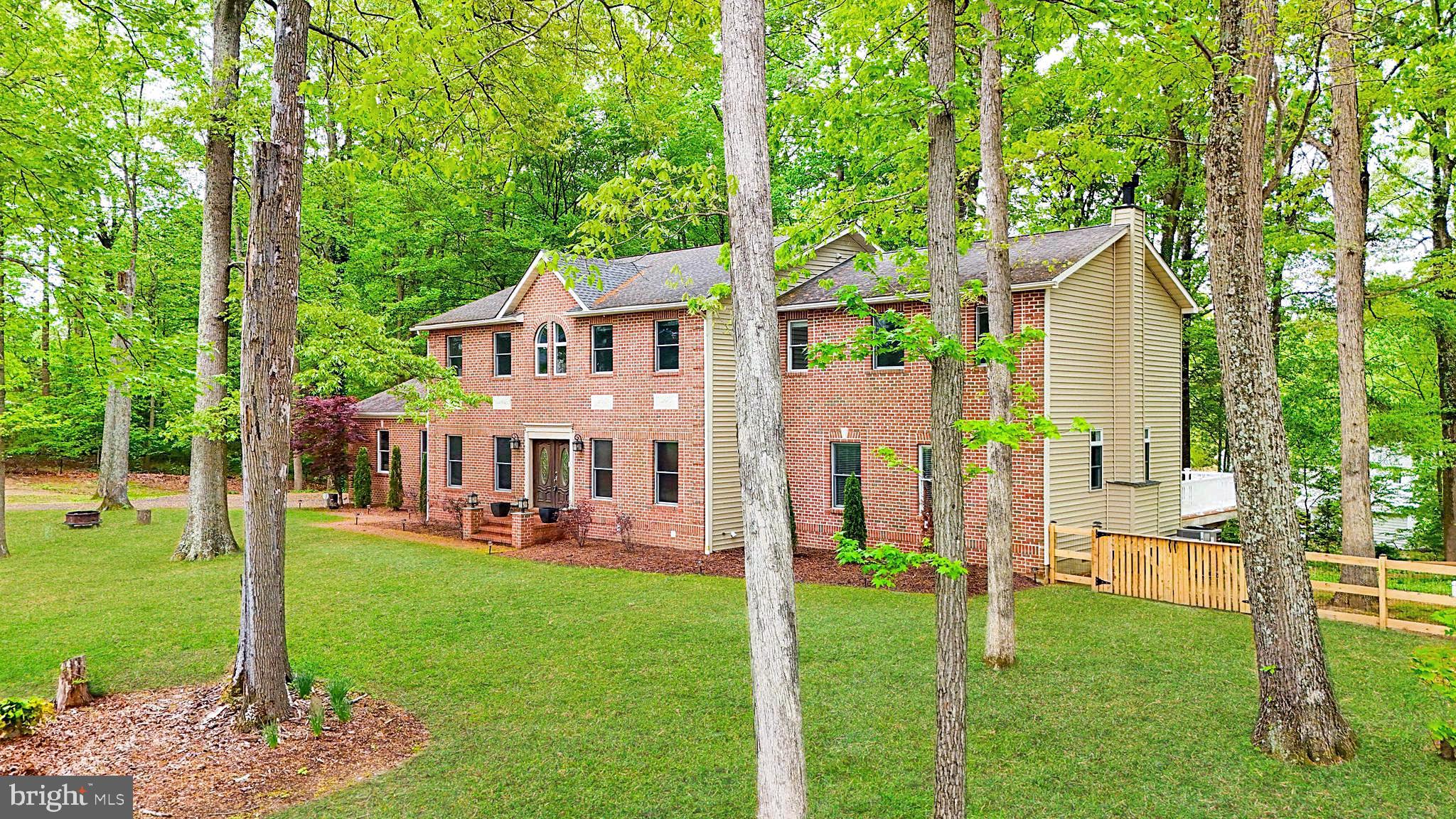5185 Meadows Farm Road Lothian, MD 20711 - Photo 3 of 29 a front view of a house with a yard table and chairs