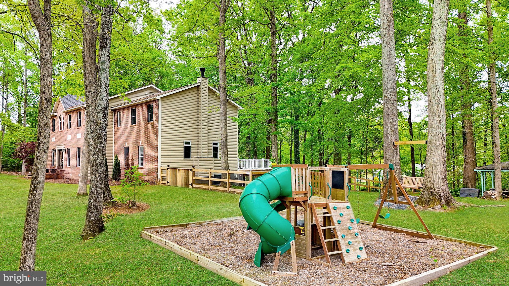 5185 Meadows Farm Road Lothian, MD 20711 - Photo 4 of 29 a view of a house with backyard sitting area and garden