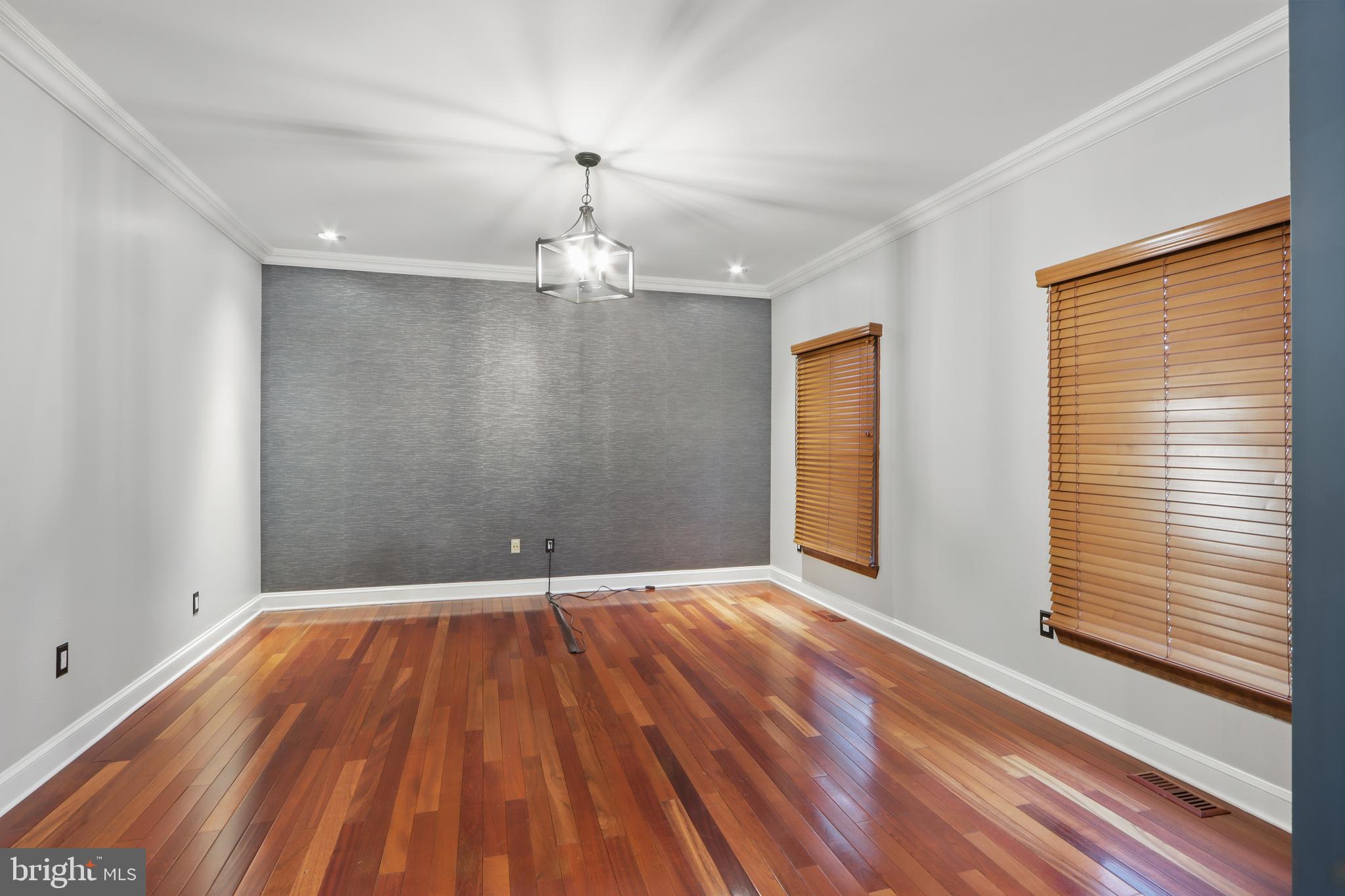 5185 Meadows Farm Road Lothian, MD 20711 - Photo 6 of 29 a view of an empty room with wooden floor and a window