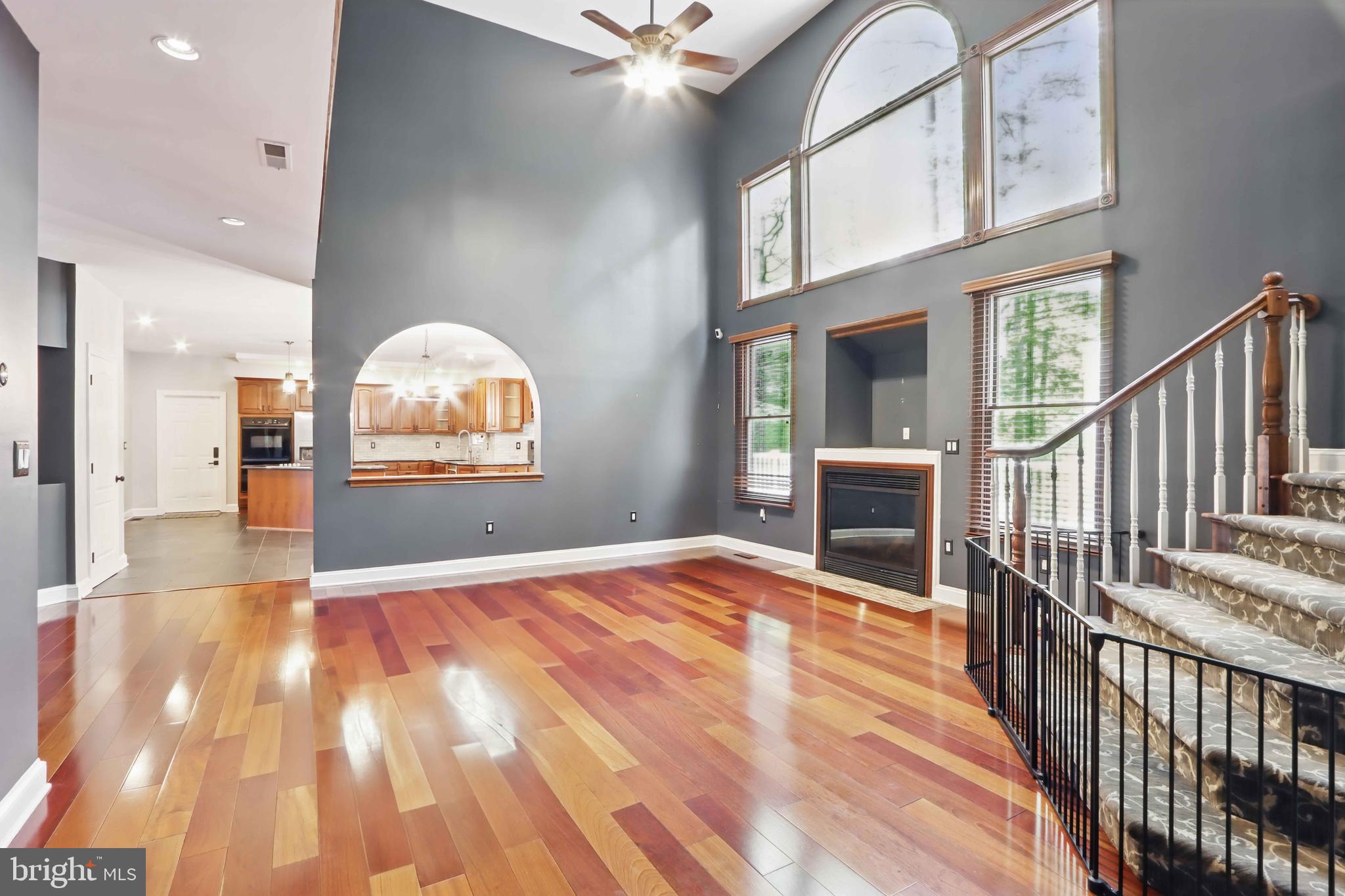 5185 Meadows Farm Road Lothian, MD 20711 - Photo 9 of 29 a view of a livingroom with wooden floor and staircase