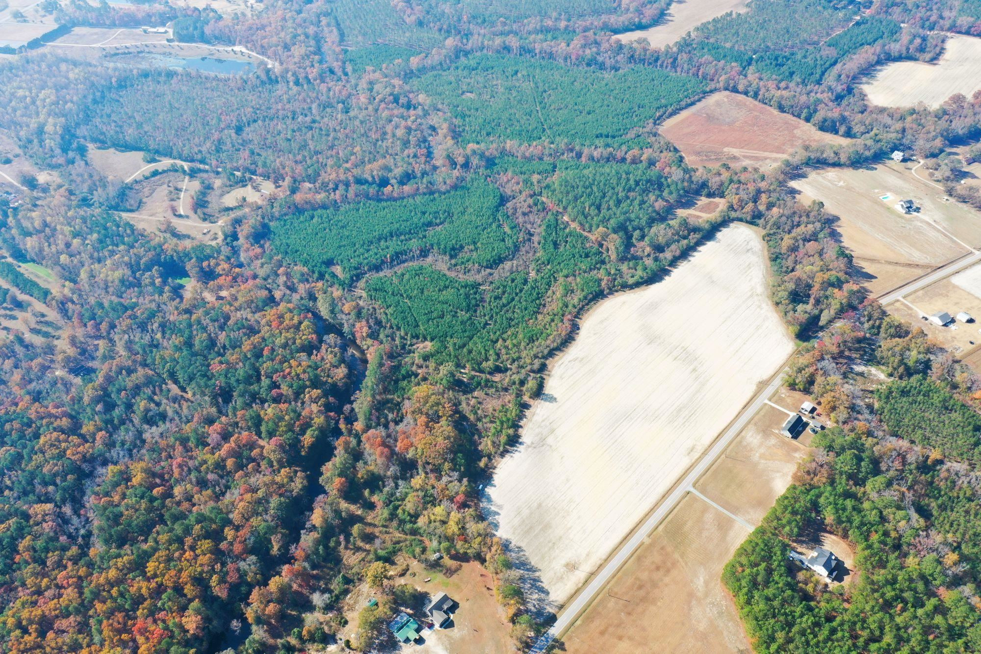 8 Josey Williams Road Erwin, NC 28339 - Photo 10 of 26 an aerial view of a house with a yard and garden