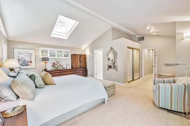 a bedroom with bed and window