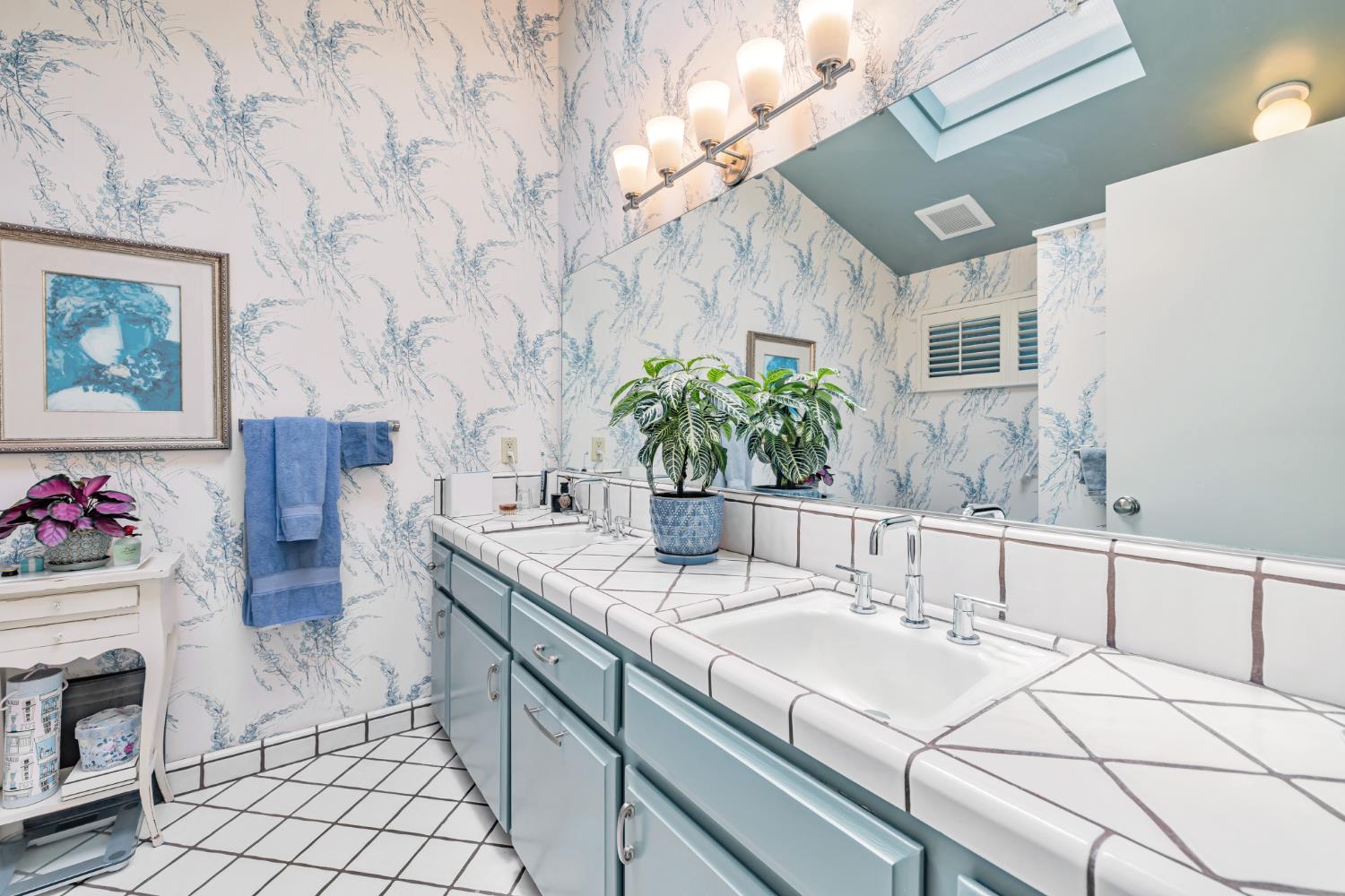 1625 Gary Way Carmichael, CA 95608 - Photo 15 of 49 a bathroom with a sink and a mirror