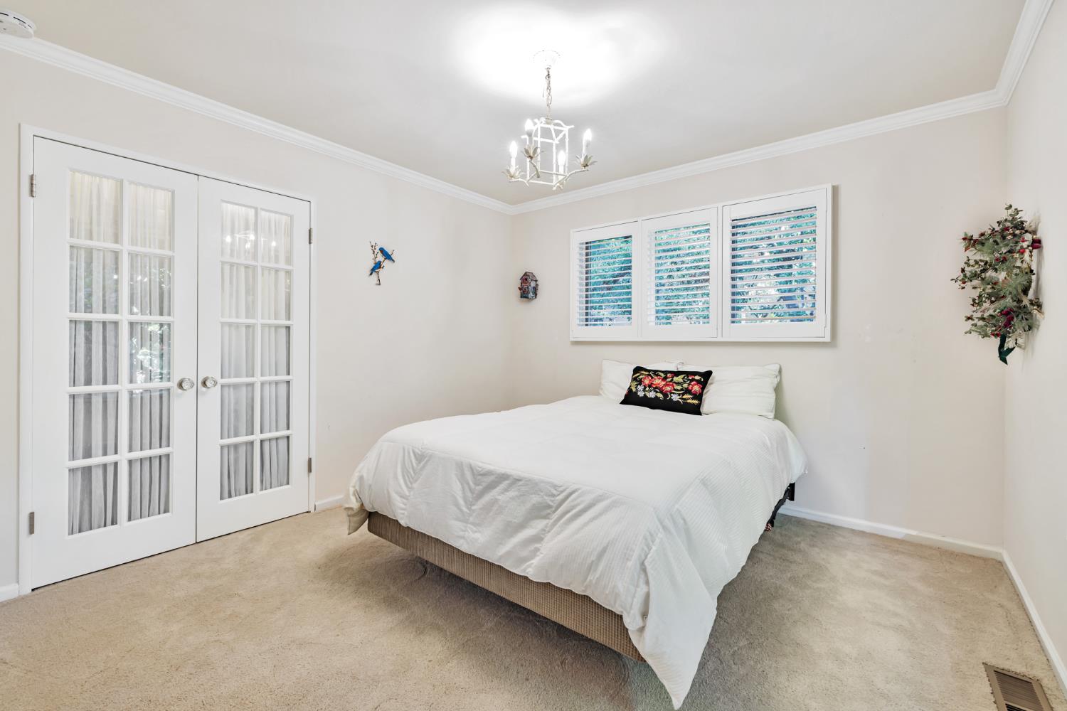 1625 Gary Way Carmichael, CA 95608 - Photo 17 of 49 a bedroom with a bed and a window