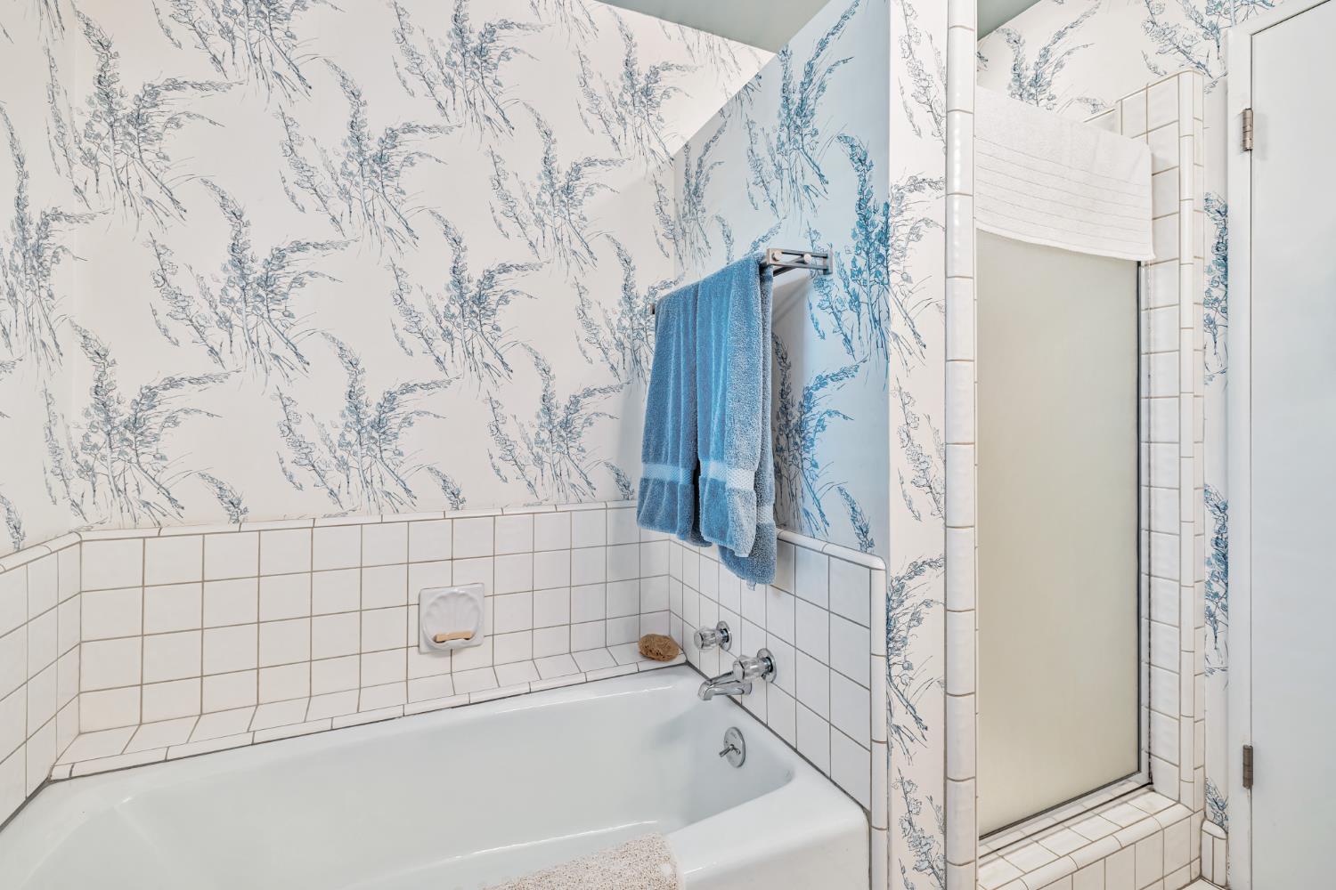 1625 Gary Way Carmichael, CA 95608 - Photo 19 of 49 a bathroom with a bathtub and a shower