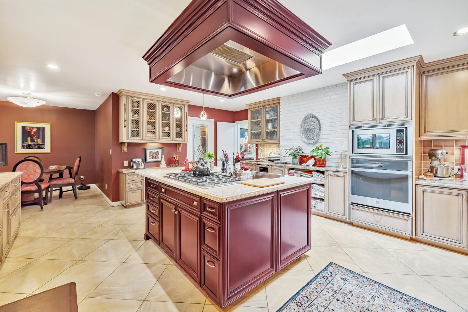 1625 Gary Way Carmichael, CA 95608 - Photo 23 of 49 a kitchen with stainless steel appliances granite countertop a stove and a view of living room