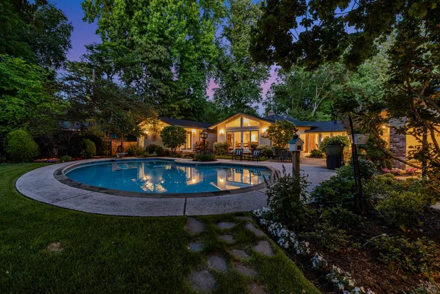 a view of swimming pool from a yard