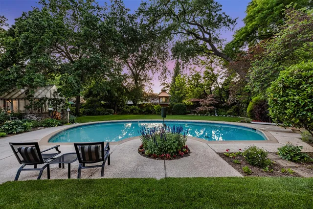 a view of a swimming pool with a patio