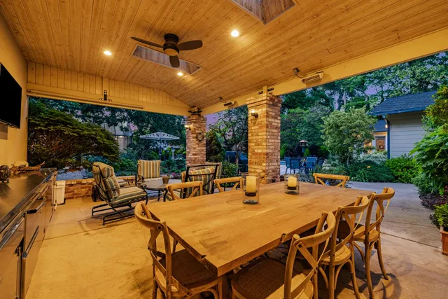 a view of a patio with a table and chairs