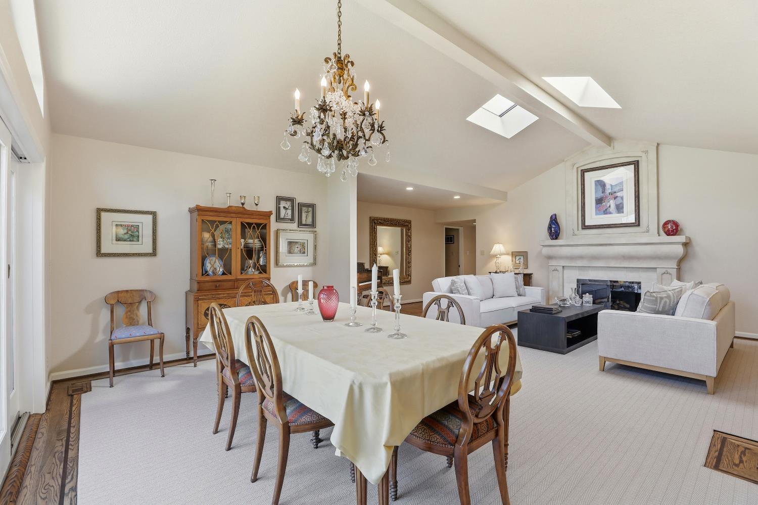1625 Gary Way Carmichael, CA 95608 - Photo 37 of 49 a view of a dining room with furniture a chandelier and wooden floor