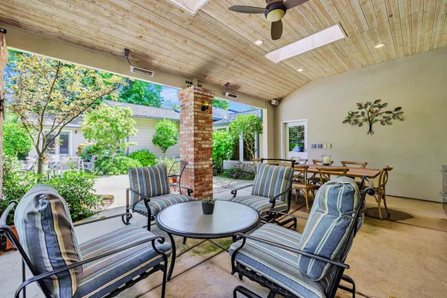 a view of a dining room with furniture window and outside view