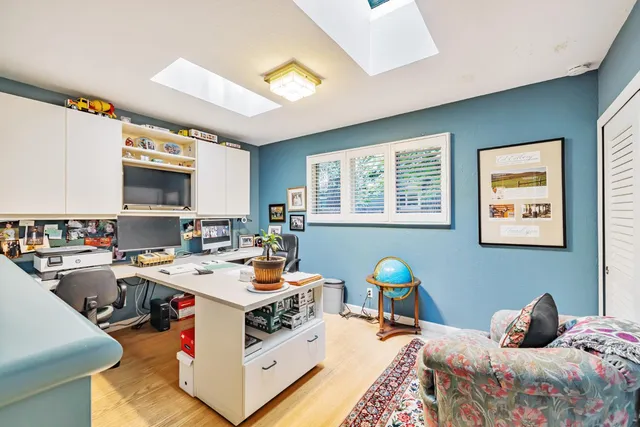 a workspace with furniture and window