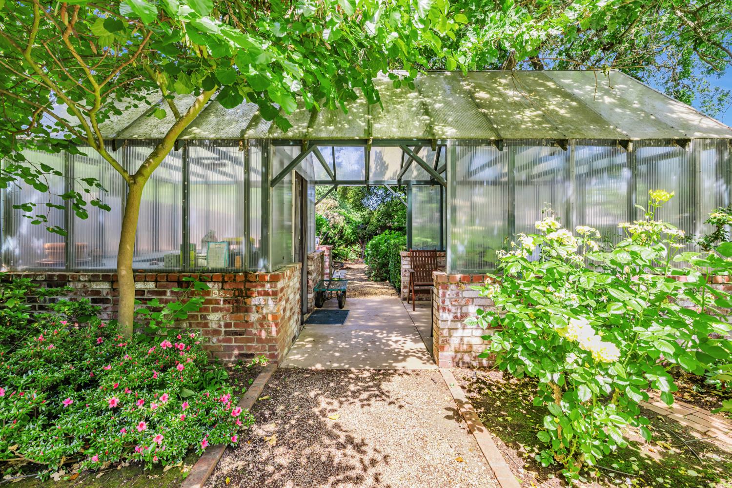 1625 Gary Way Carmichael, CA 95608 - Photo 10 of 49 a backyard of a house with a garden and outdoor seating
