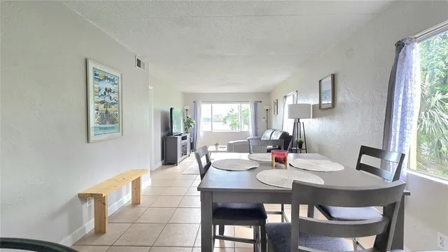 a view of a dining room with furniture window and outside view
