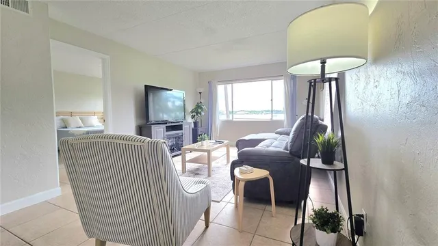 a living room with furniture and a window