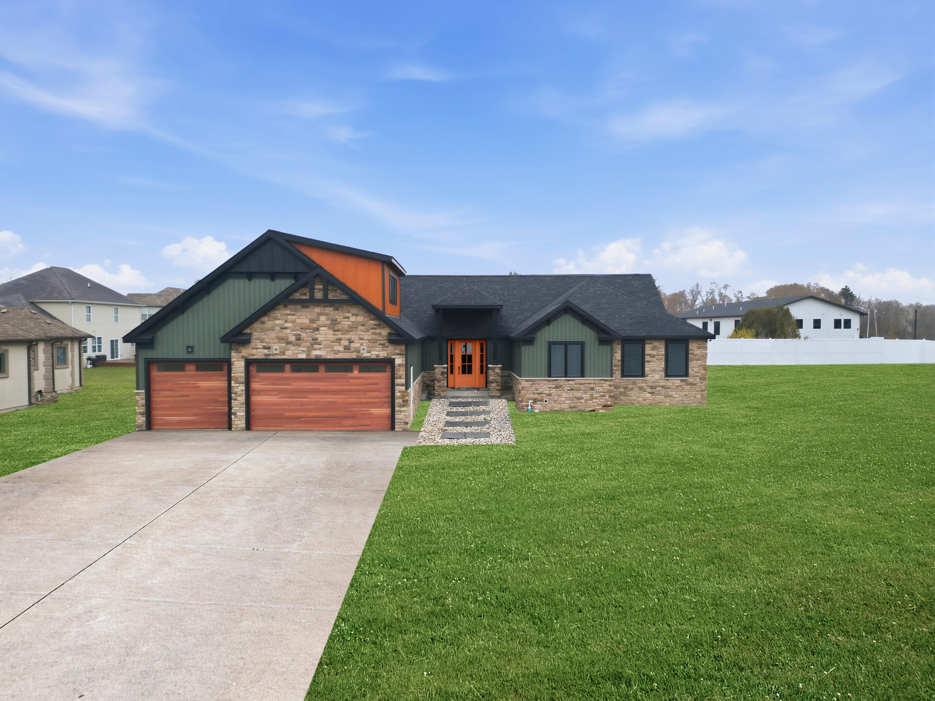 7342 Brookhaven Drive Crown Point, IN 46307 - Photo 2 of 13 a front view of a house with garden