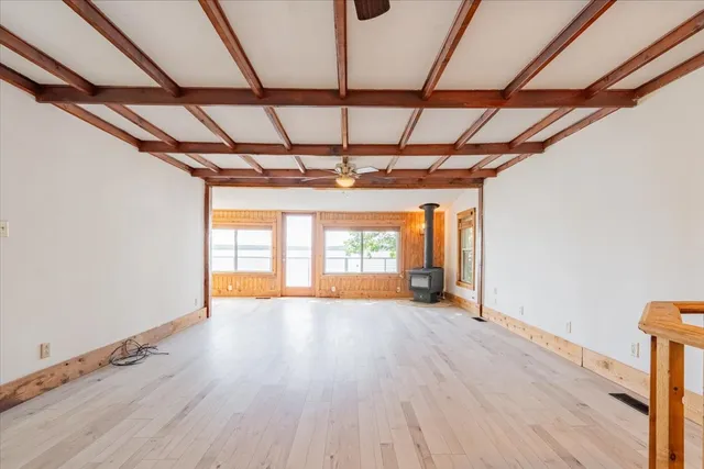 a view of hallway with wooden floor