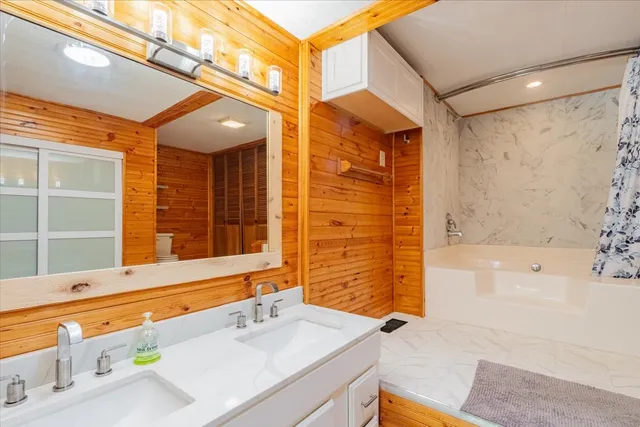 a bathroom with a sink and a bathtub
