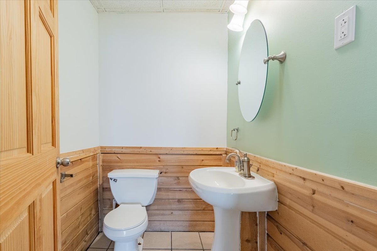 16032 North Portage Street Chillicothe, IL 61523 - Photo 23 of 34 a bathroom with a sink a toilet and a mirror