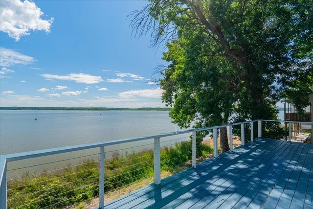 a view of outdoor space with deck and yard