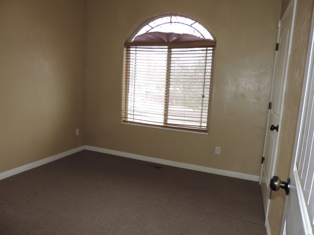 140 North 200 E Street Glenwood, UT 84730 - Photo 14 of 54 Unfurnished room with dark colored carpet and baseboards