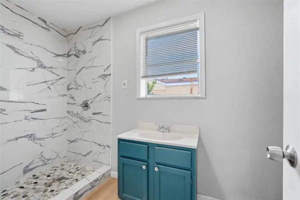 a bathroom with a sink and a shower
