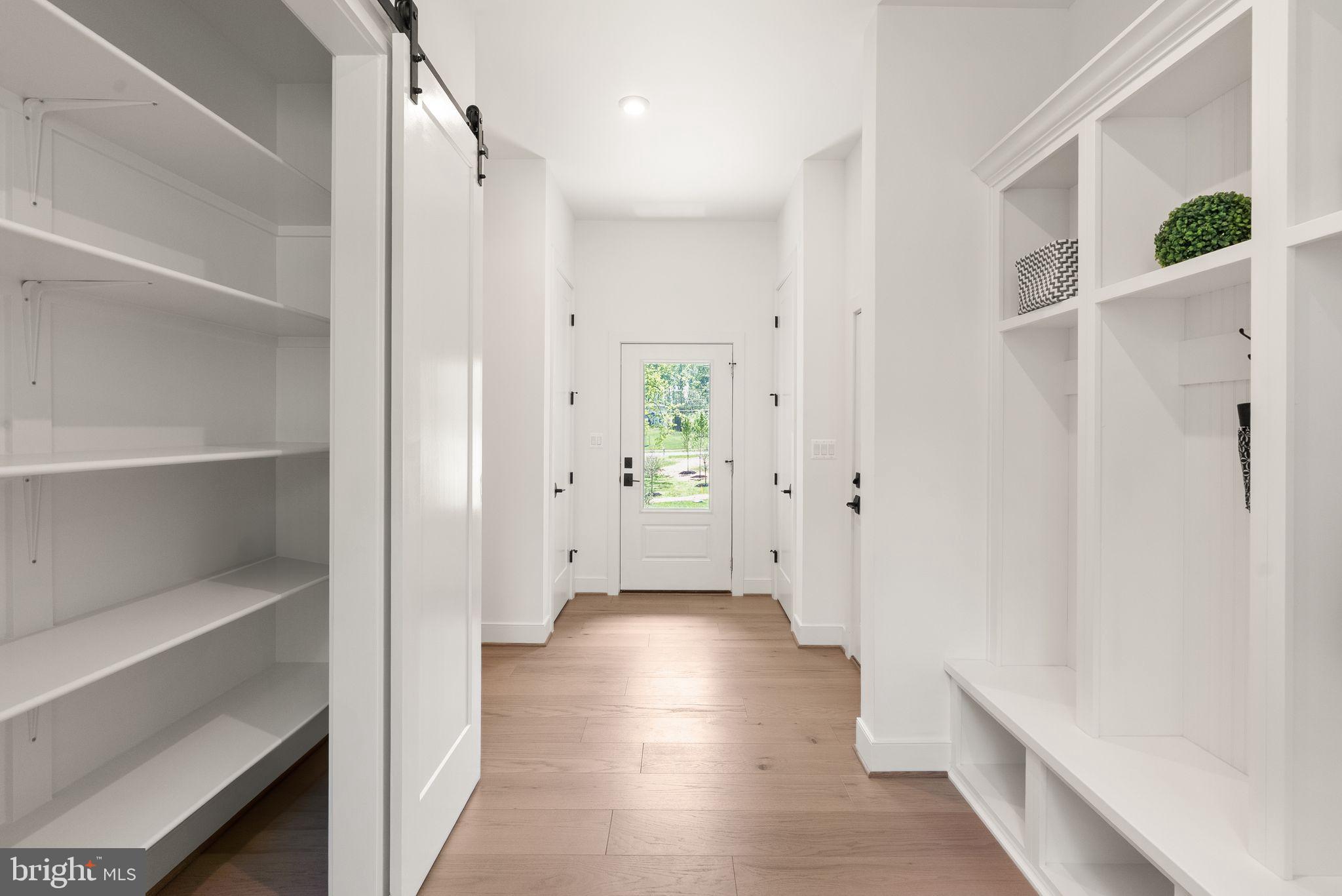 7215 Barnett Road Bethesda, MD 20817 - Photo 14 of 39 a view of a hallway view with wooden floor and staircase