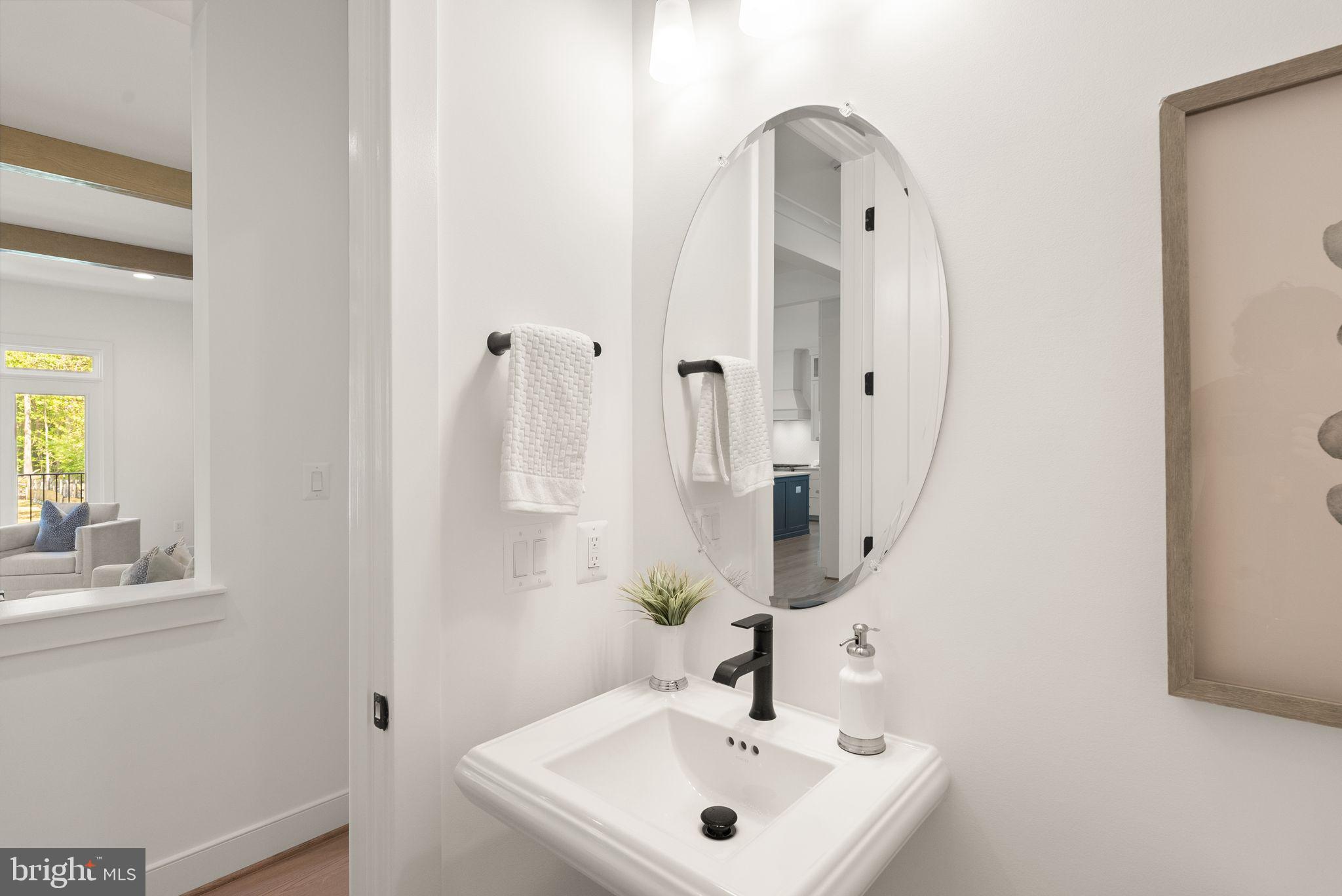 7215 Barnett Road Bethesda, MD 20817 - Photo 19 of 39 a bathroom with a sink and a mirror