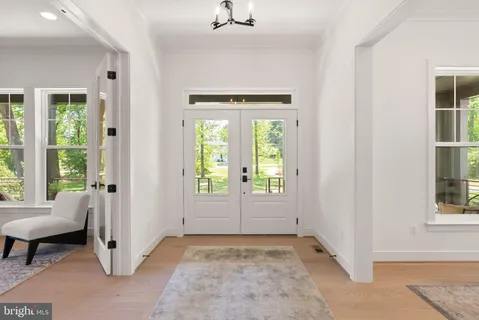 a view of a livingroom with a fireplace and window