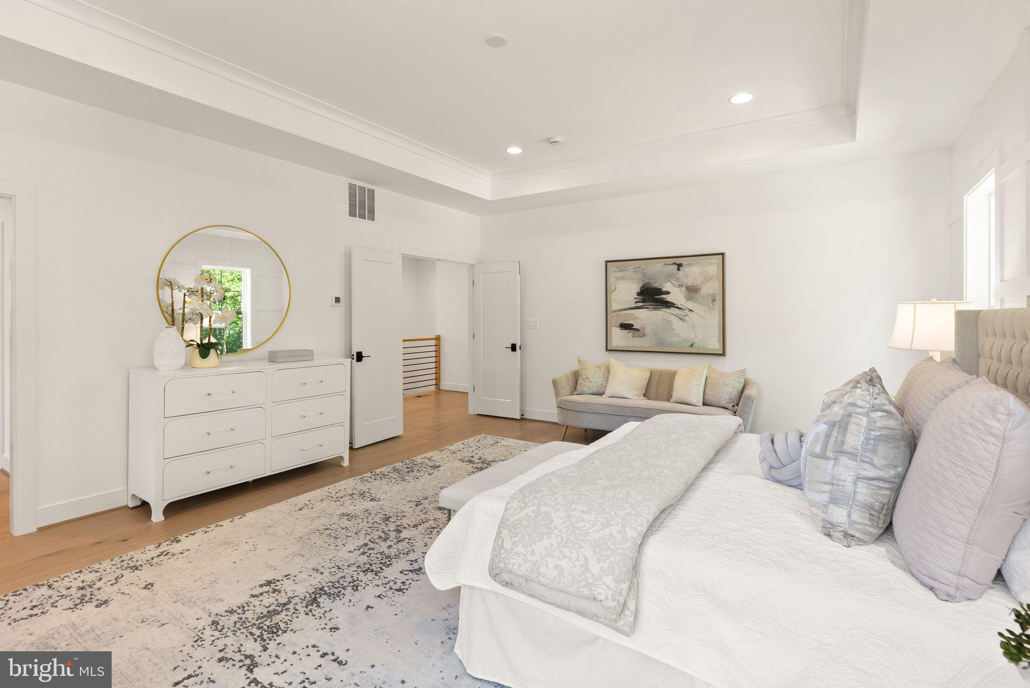 7215 Barnett Road Bethesda, MD 20817 - Photo 22 of 39 a spacious bedroom with a bed and a dresser
