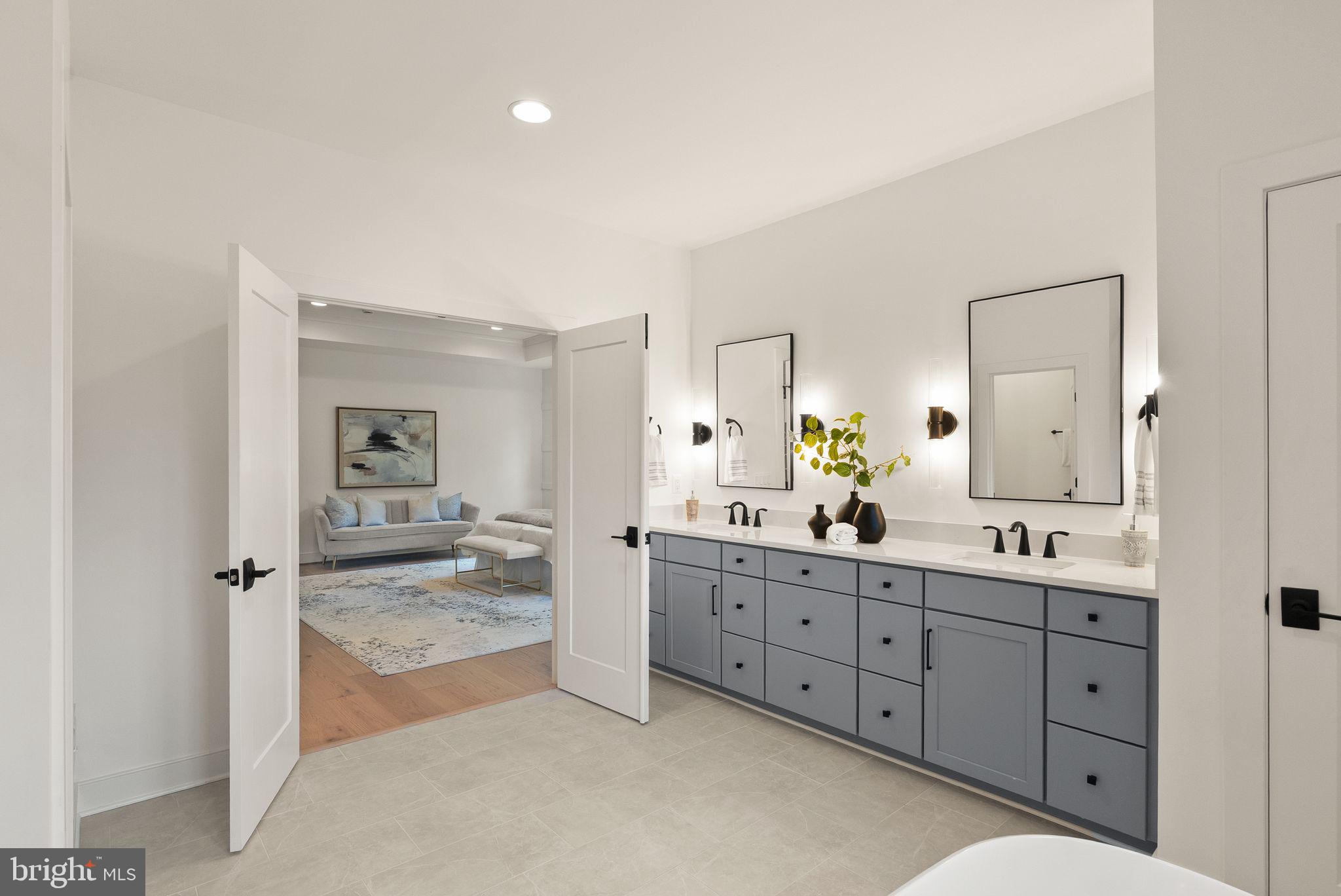 7215 Barnett Road Bethesda, MD 20817 - Photo 23 of 39 a spacious bathroom with a granite countertop sink mirror and shower
