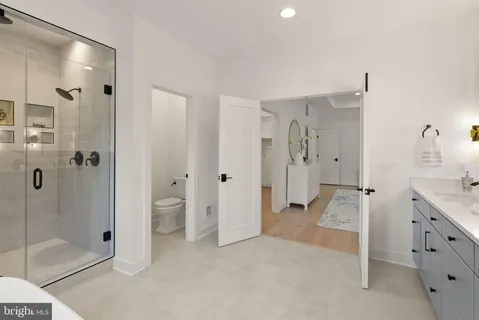 a bathroom with a shower and a sink
