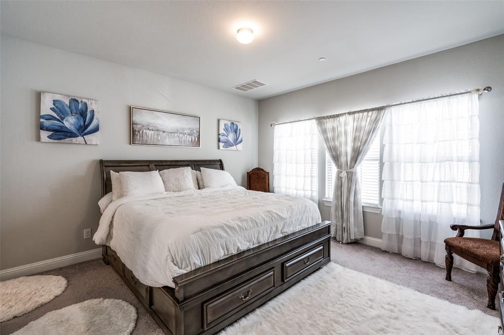 1560 Windermere Way Dallas, TX 75234 - Photo 13 of 25 Bedroom featuring carpet floors and baseboards