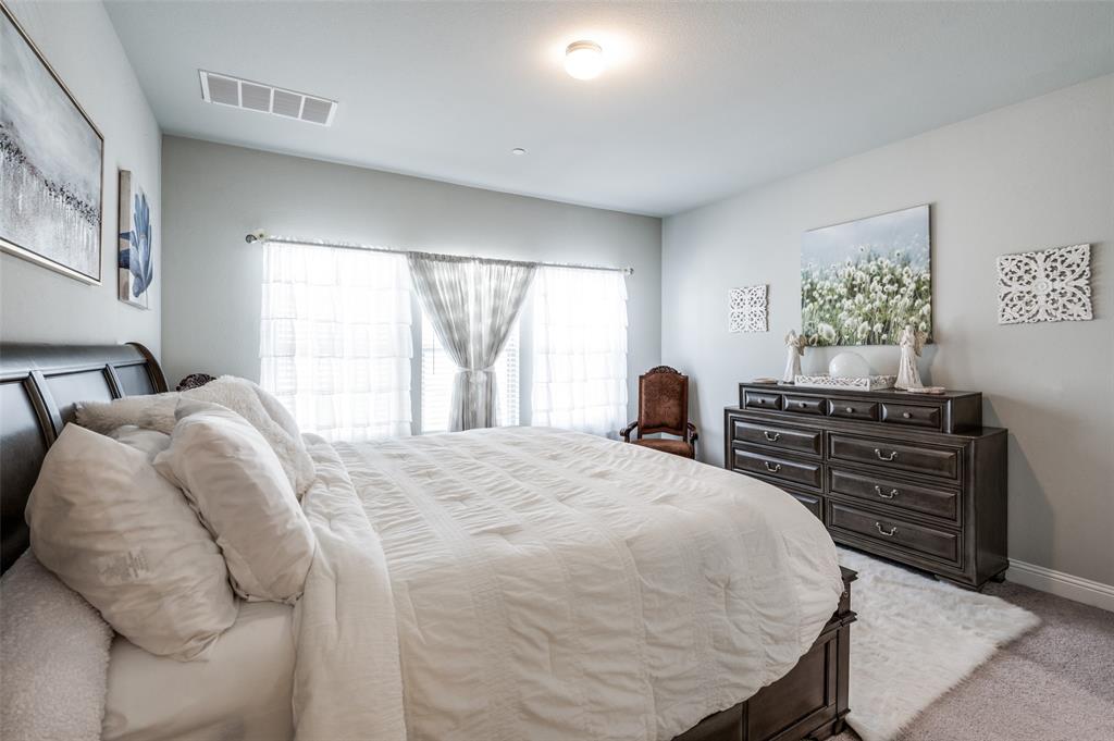 1560 Windermere Way Dallas, TX 75234 - Photo 14 of 25 Carpeted bedroom with baseboards