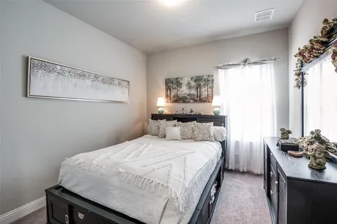 a bedroom with a bed and a table