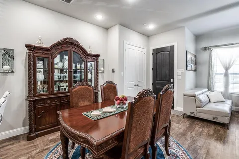 a living room with furniture a flat screen tv and a window
