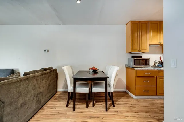 a view of room with wooden floor