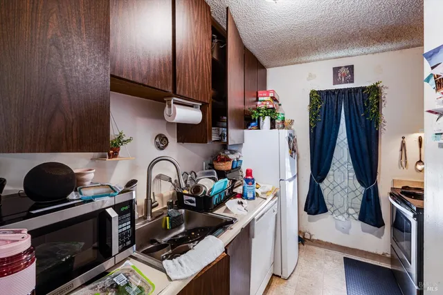 a picture of a bench in front of a wall