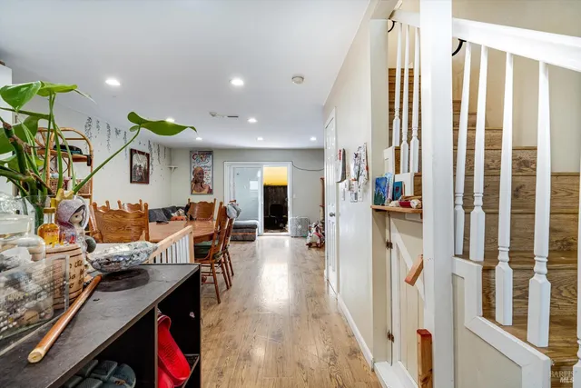 a living room with furniture and kitchen view