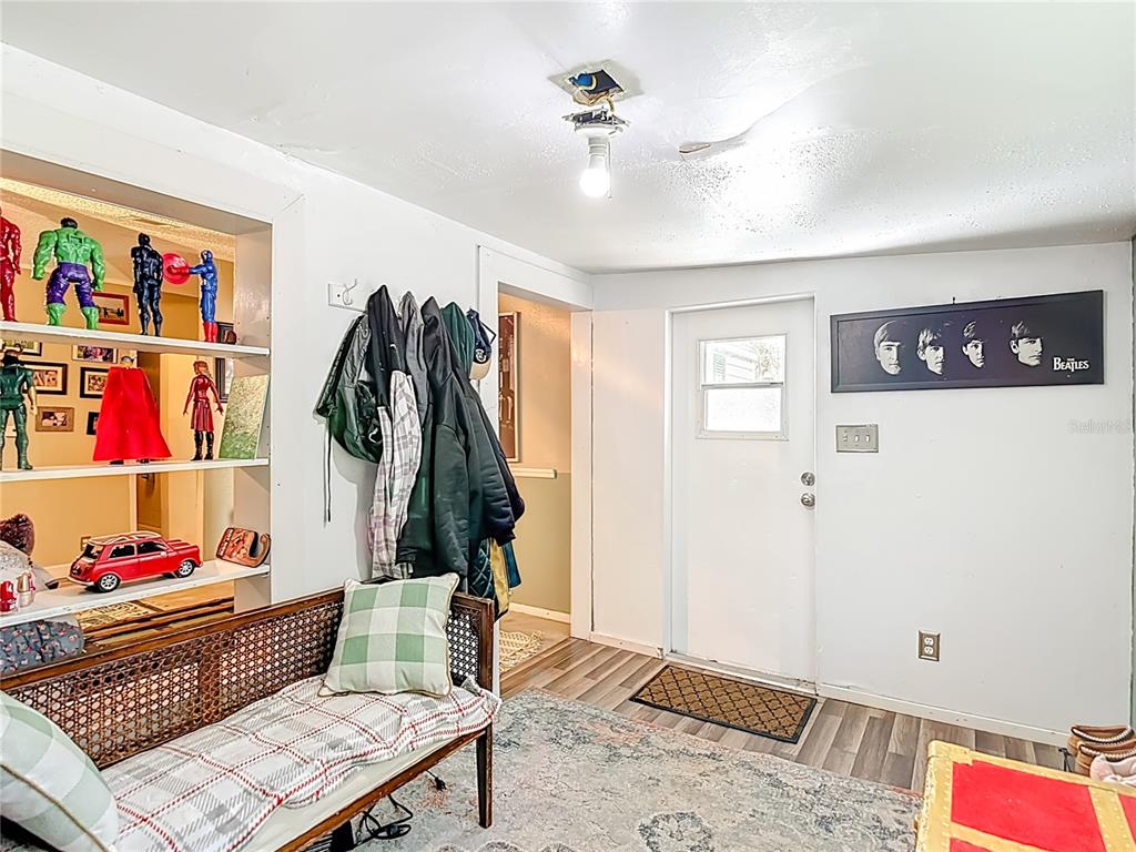 6421 Sunnyside Ranch Road Brooksville, FL 34602 - Photo 12 of 49 a living room with furniture and a rug