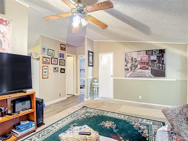 a bedroom with furniture and flat screen tv