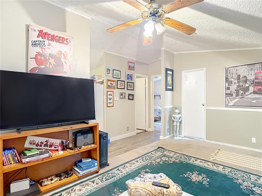 6421 Sunnyside Ranch Road Brooksville, FL 34602 - Photo 17 of 49 a living room with flat screen tv and a couch