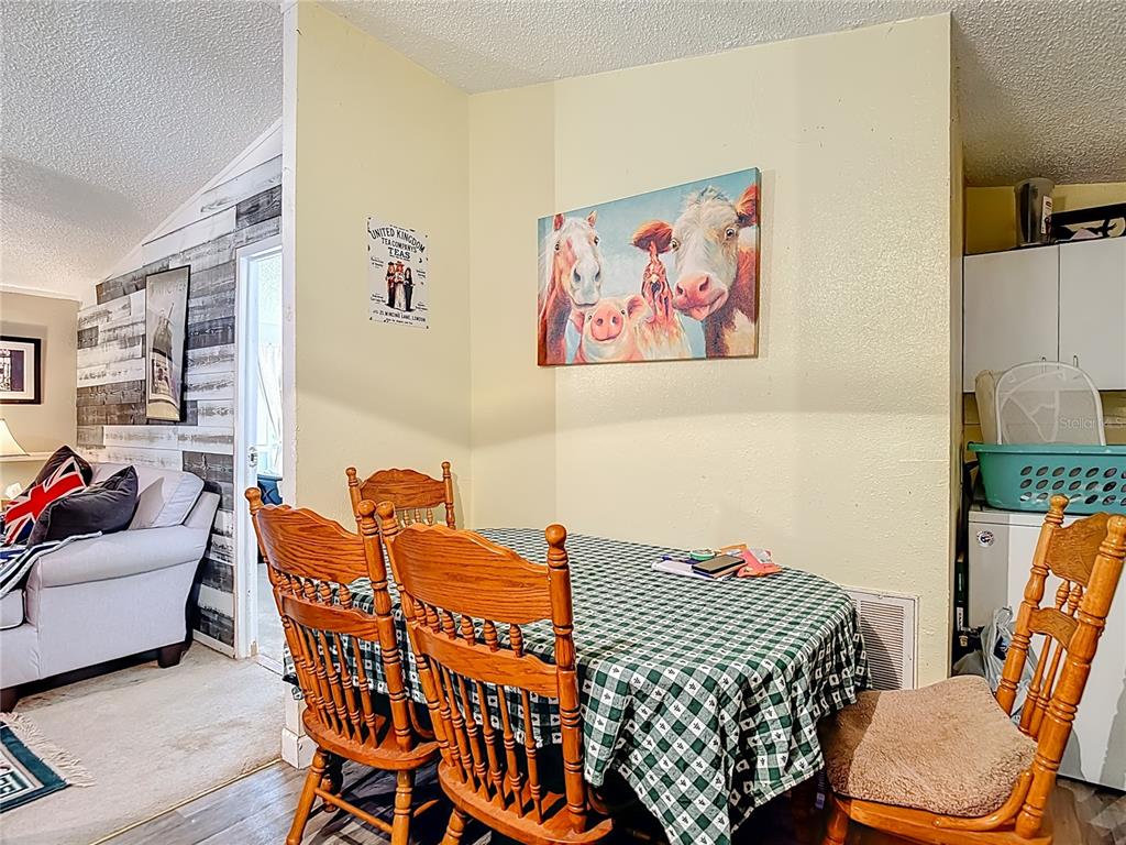 6421 Sunnyside Ranch Road Brooksville, FL 34602 - Photo 23 of 49 a living room with furniture a rug and a window