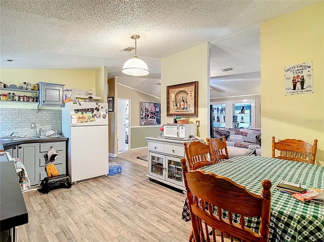 a bedroom with furniture and a chandelier
