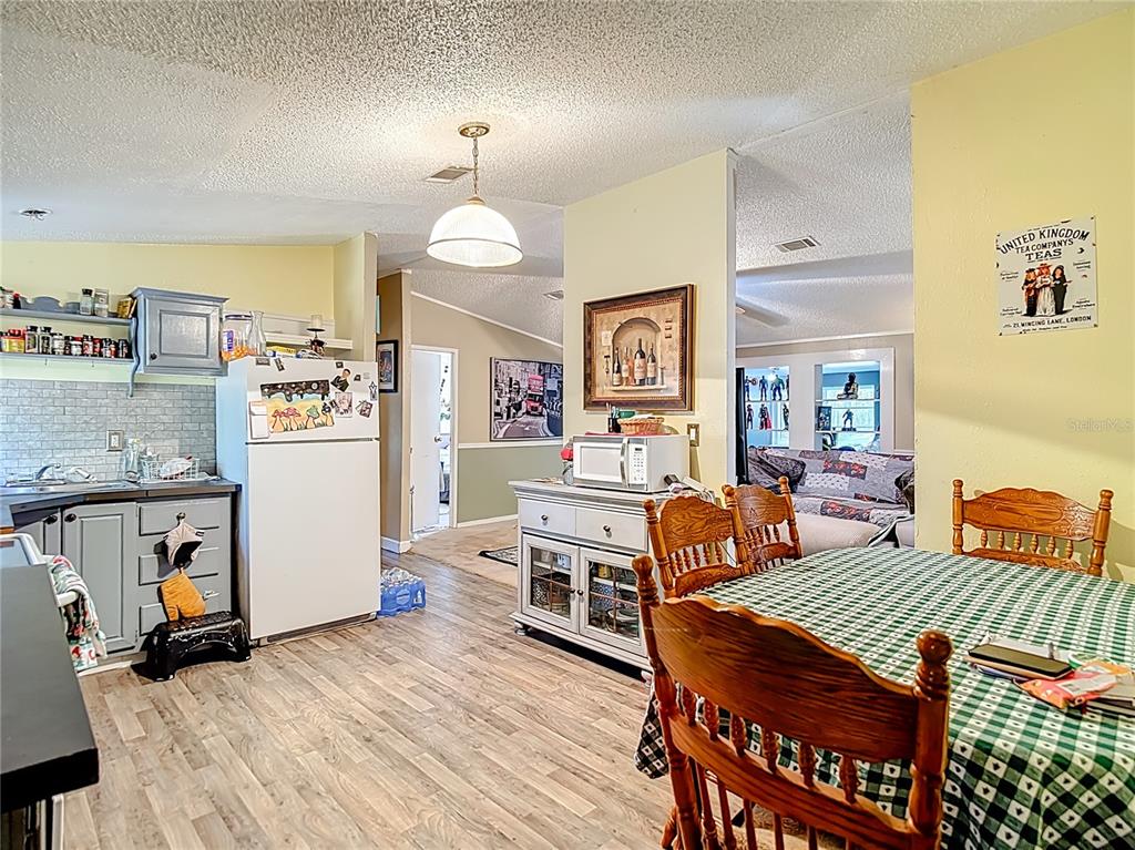 6421 Sunnyside Ranch Road Brooksville, FL 34602 - Photo 24 of 49 a bedroom with furniture and a chandelier