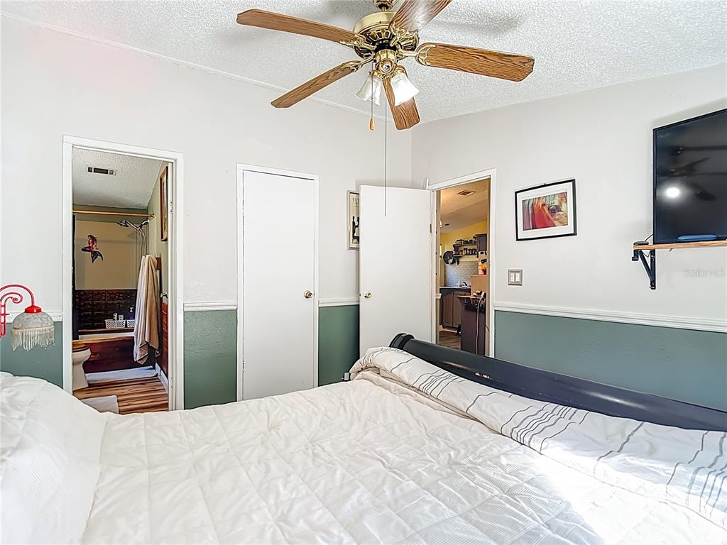 6421 Sunnyside Ranch Road Brooksville, FL 34602 - Photo 25 of 49 a bedroom with a bed and a flat screen tv