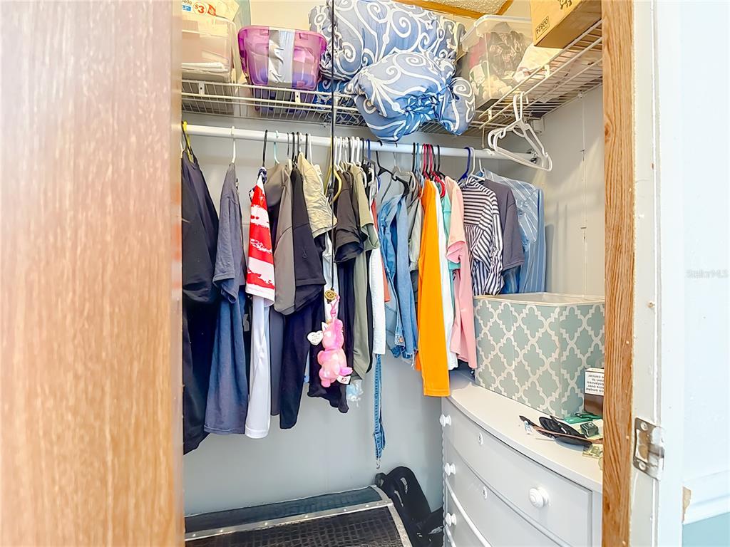 6421 Sunnyside Ranch Road Brooksville, FL 34602 - Photo 30 of 49 a view of walk in closet with clothes