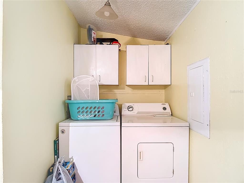 6421 Sunnyside Ranch Road Brooksville, FL 34602 - Photo 38 of 49 a utility room with dryer and washer