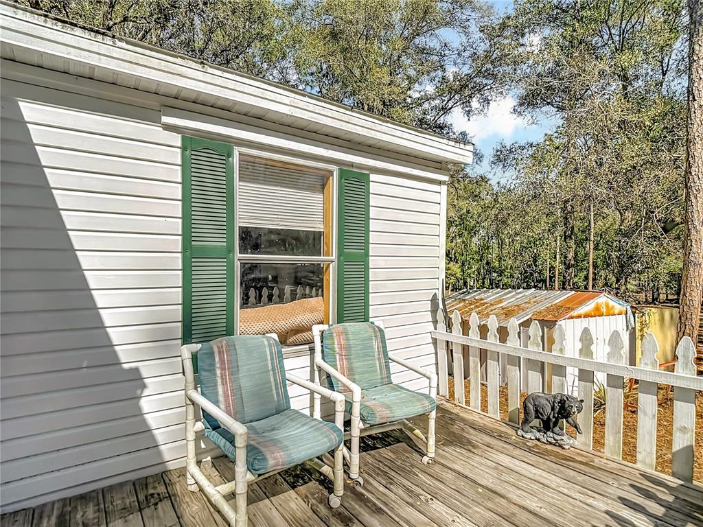 6421 Sunnyside Ranch Road Brooksville, FL 34602 - Photo 4 of 49 a balcony view with a seating space