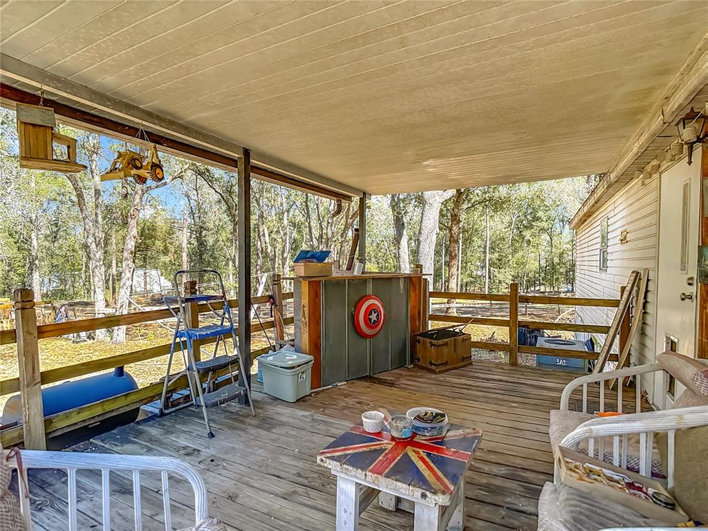 6421 Sunnyside Ranch Road Brooksville, FL 34602 - Photo 7 of 49 wooden outdoor space with seating
